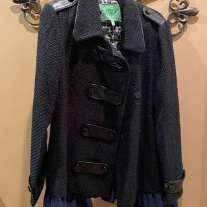 Brand new never been worn jacket. Black with black and navy removable ruffle